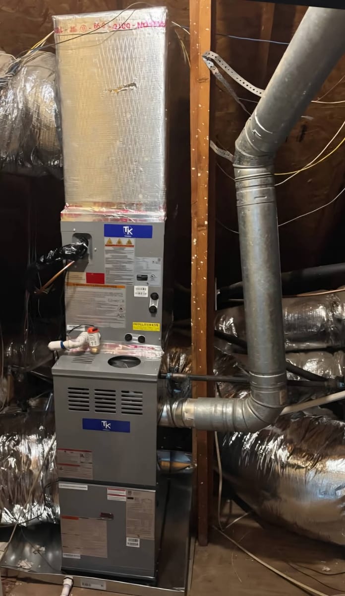 High-efficiency gas furnace installed in an attic