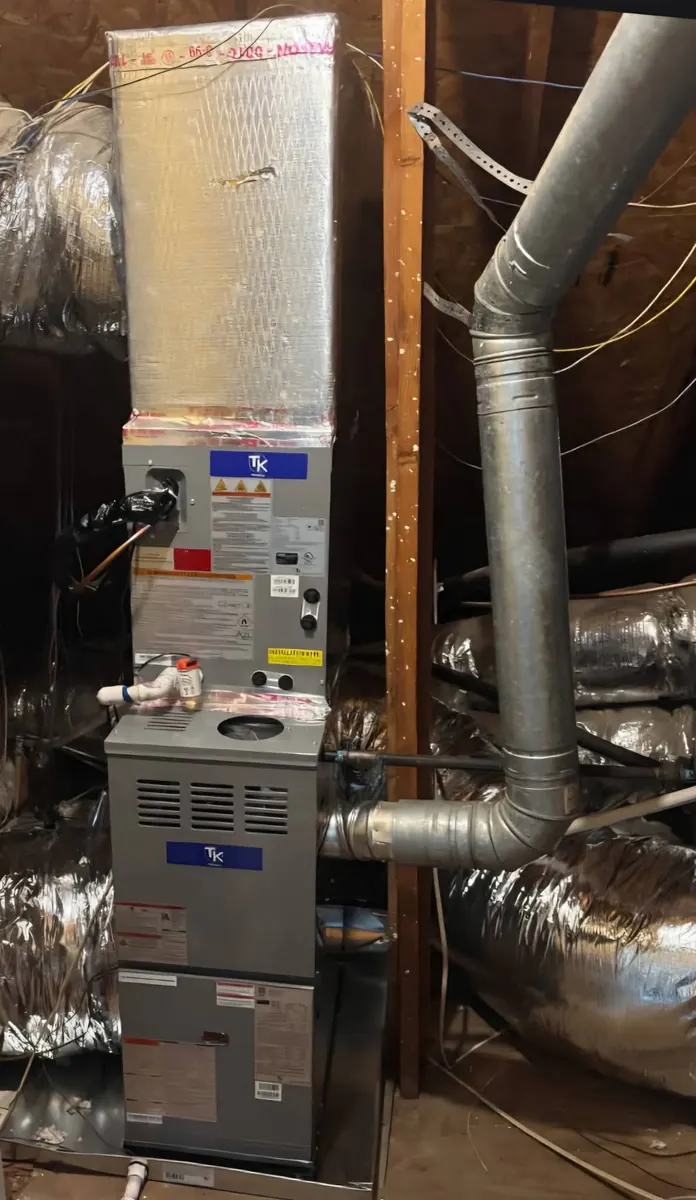 High-efficiency gas furnace installed in an attic