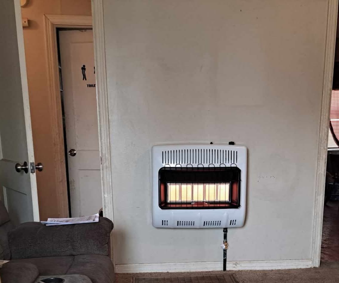 Gas wall heater installation