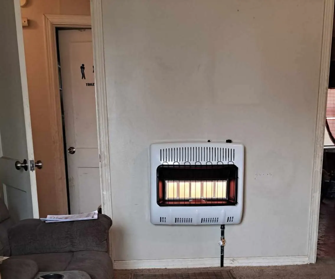 Gas wall heater installation